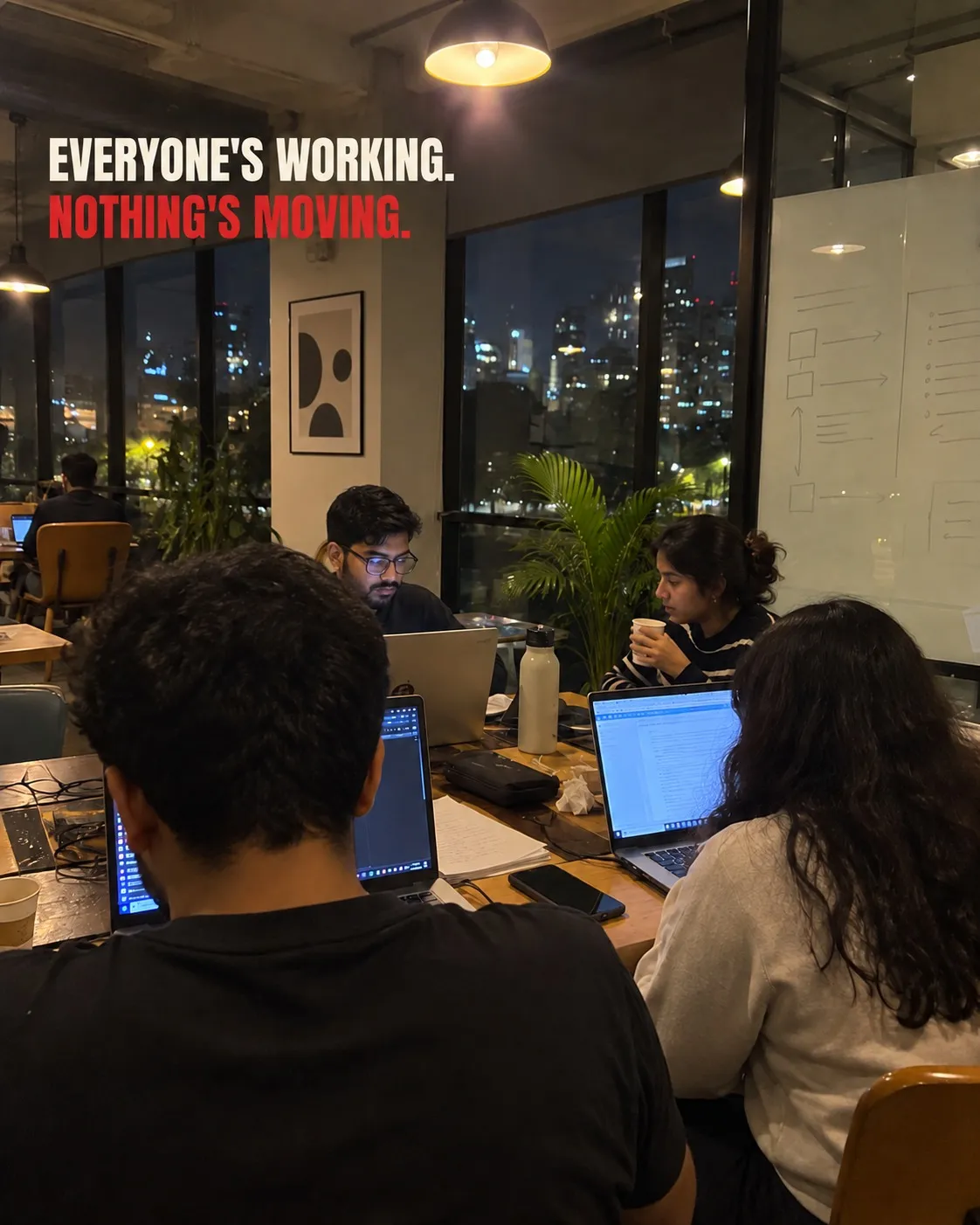 A team working together at night beneath the words: Everyone's working. Nothing's moving.